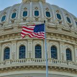 Flag flying in front of the Capitol building